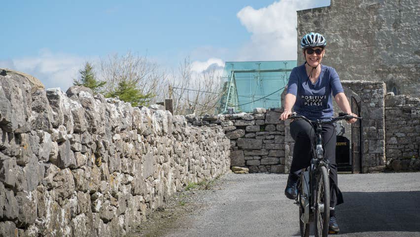 Woman on bike rented at e-whizz Kilfenora County Clare