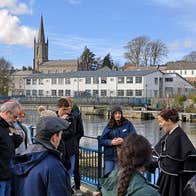 A group of people led by a guide in costume on the Sligo Dark Tales Tour