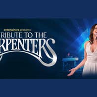 A Tribute to The Carpenters, woman in white dress singing into a mic she's holding