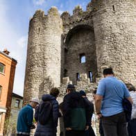 People standing at St Laurence's Gate in Drogheda, Co Louth