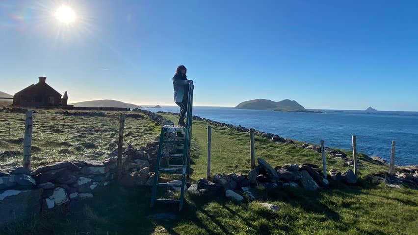 A lady out on the Dingle Film Walk with the Blasket Islands in the background