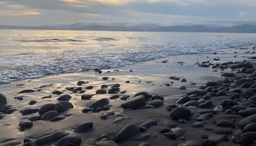 View out over Rossbeigh White Strand with the mountains in the background
