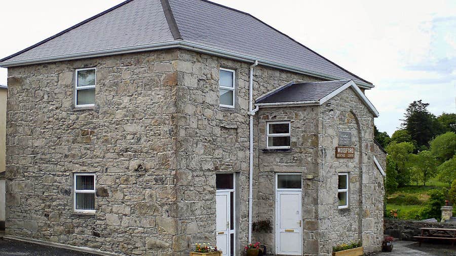 The exterior of the stone building housing the Woodford Heritage Centre