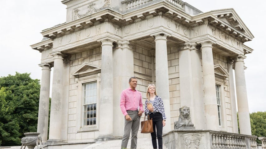 A couple standing outside a Casino Marino