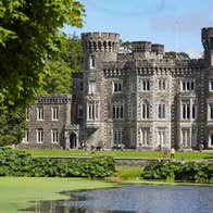 Johnstown Castle Estate exterior of the castle with the lake in front