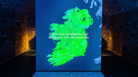 A green map of Ireland illuminated on an interactive table top display