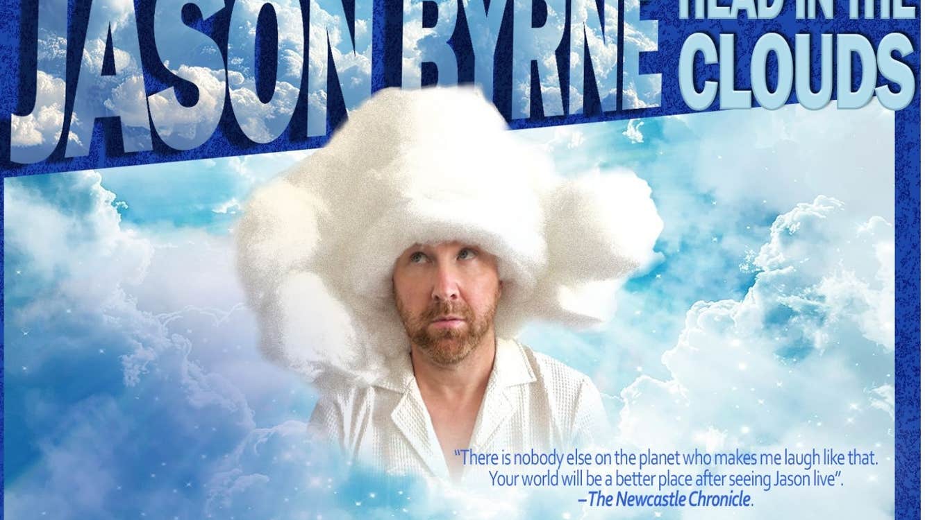 A man wearing a very large fluffy wooly hat and white shirt, surrounded by white clouds in blue sky
