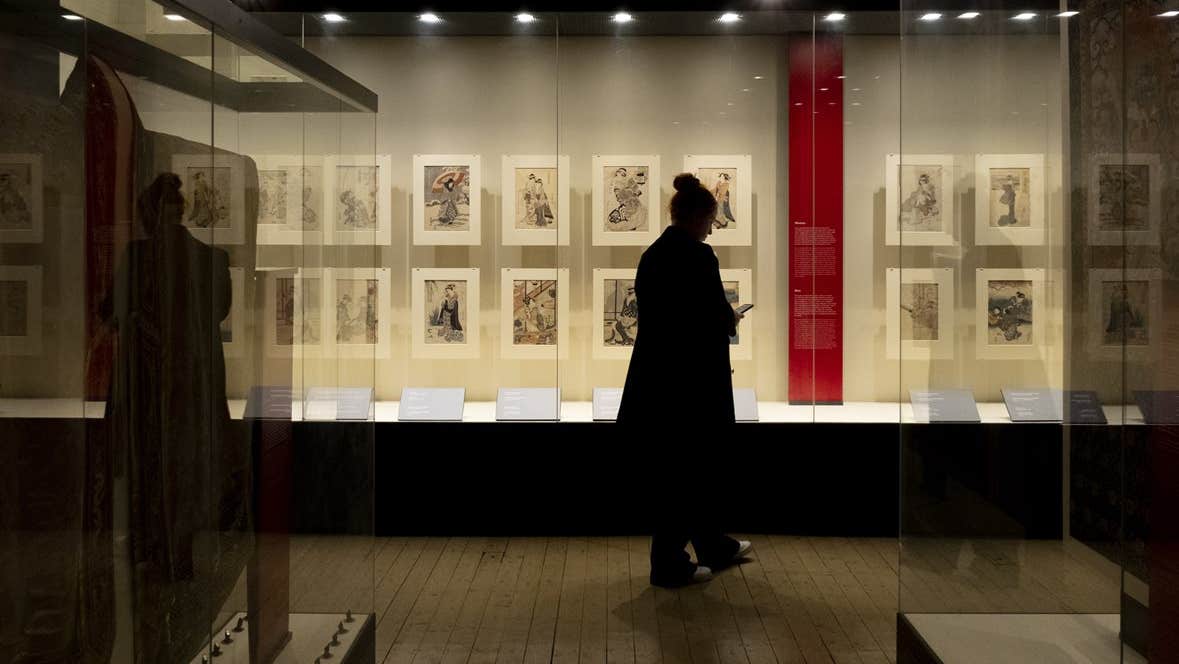 Image of a visitor exploring 'A Dubliner’s Collection of Asian Art: The Albert Bender Collection'