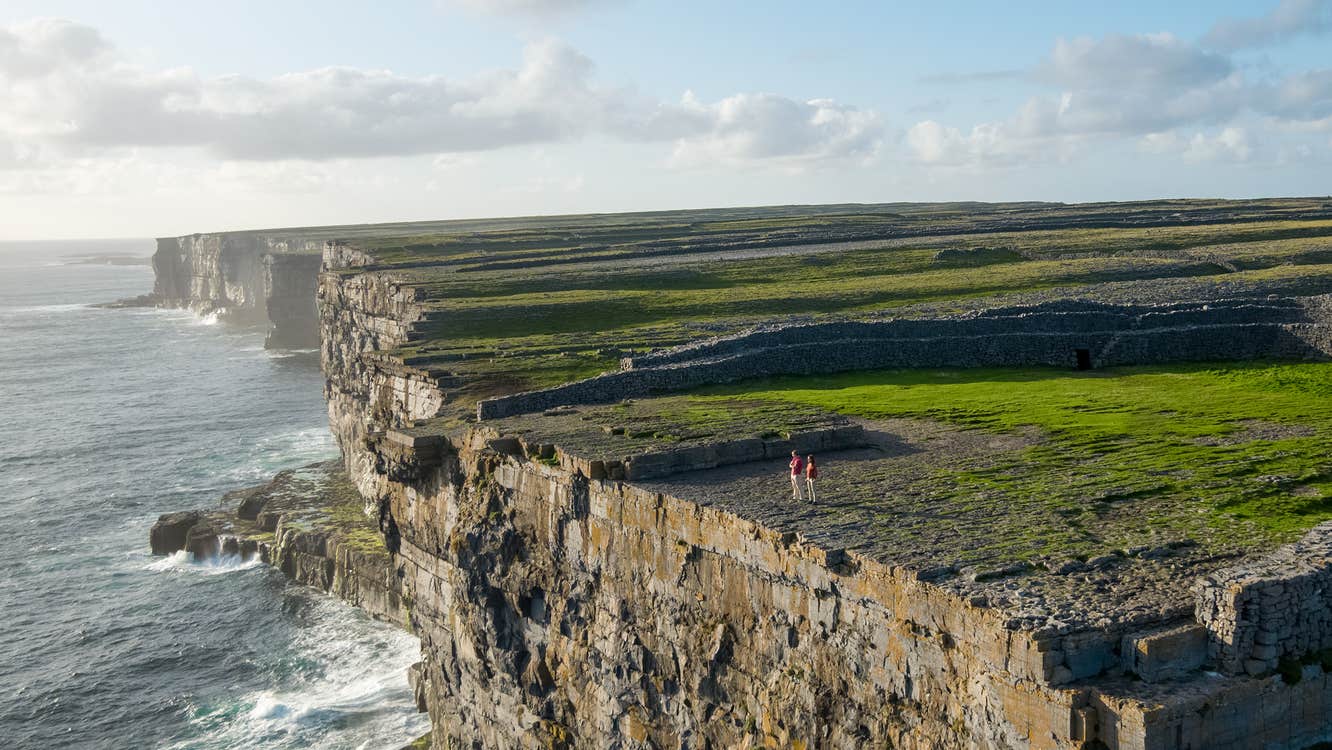 View of steep cliffs above the water at the Aran Islands