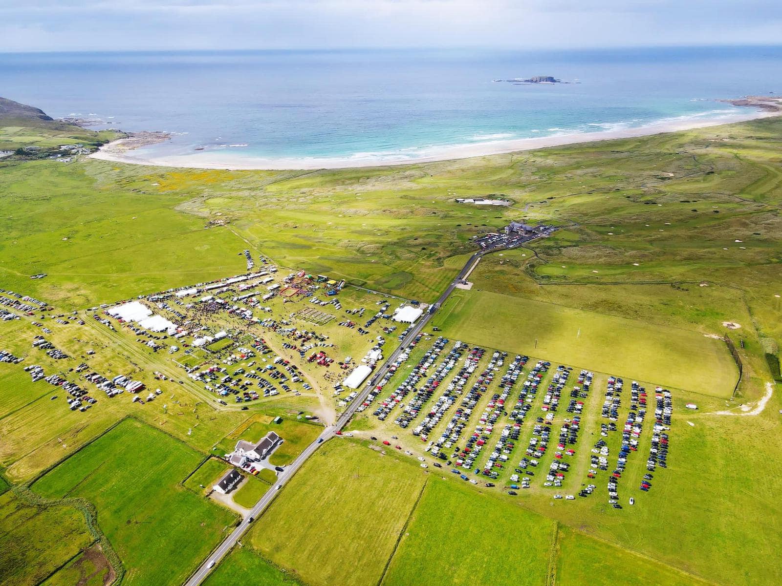 Our photography team takes advantage of the good weather to send a drone up and capture the enormity of our show against the picturesque landscape of Pollan Bay