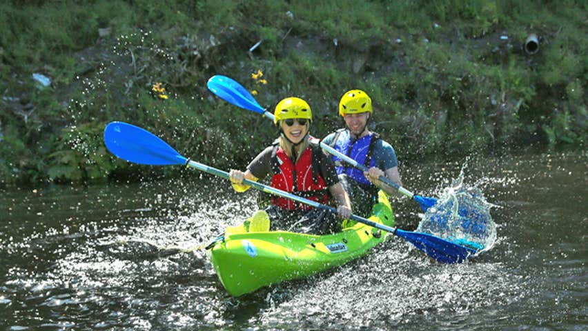 My New Adventure two kayakers splashing on the river
