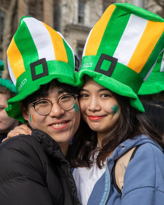 A couple in green hats at the 2022 St Patrick's Day Parade in Dublin city