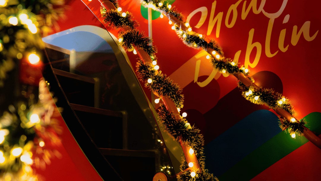 Inside the Christmas Bus, the bus is decorated with tinsel and christmas lights throughout.
