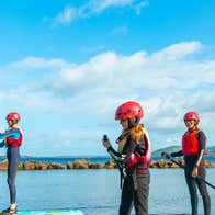 A family SUPing at UL Sports Adventure Centre in Killaloe, Co Clare