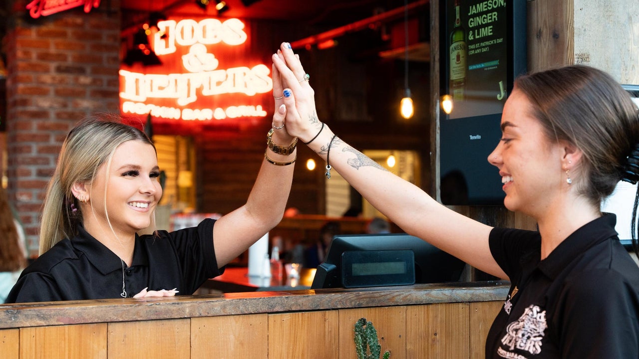 Staff high fiving at Hogs & Heifers Bar & Grill Liffey Valley