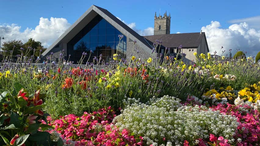 Church with gardens in foreground