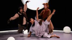 3 people dancing on a stage