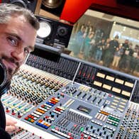 Technician at mixing deck in the studio