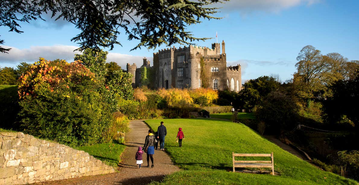 A family walking through the grounds of Birr Castle in County Offaly.
