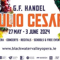 G.F. Handel's Giulio Cesare, part of poster with black or orange text against white background