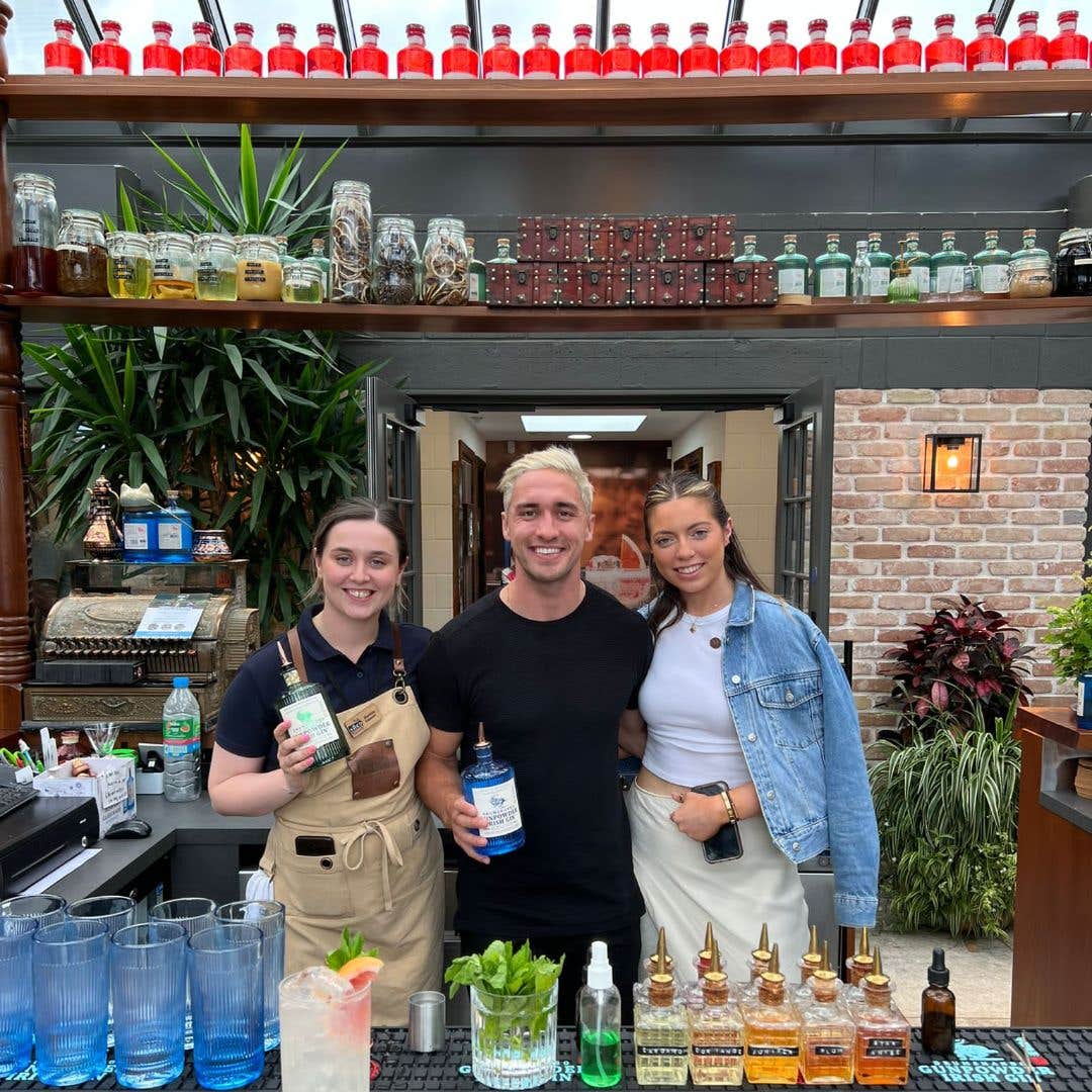 Friends standing with the bartender at The Shed Distillery Experience in Leitrim