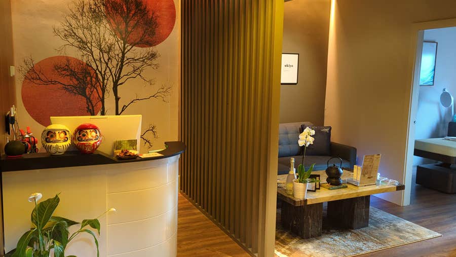 Reception desk and waiting area with Japanese decor