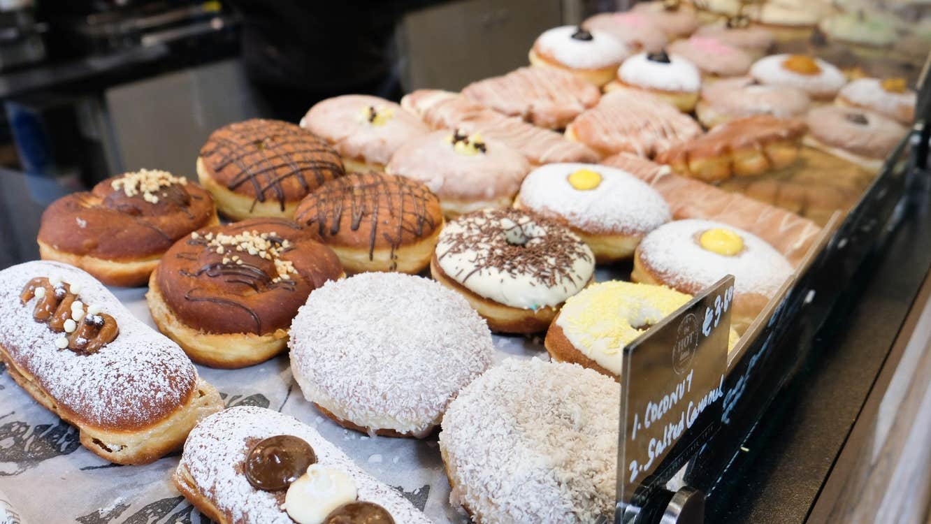 A selection of colourful doughnuts in a shop