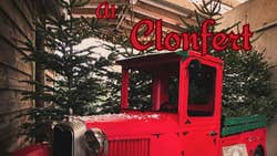 Picture of red truck with Christmas trees in the back