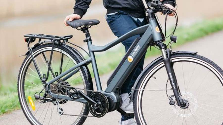 A person about to get on a bike belonging to Easy Motion in County Dublin