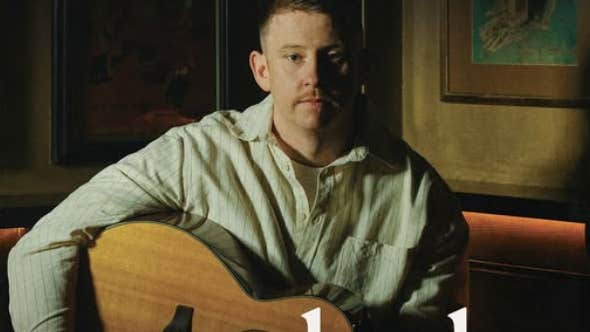 Irish singer-songwriter Conleth McGeary with a guitar.