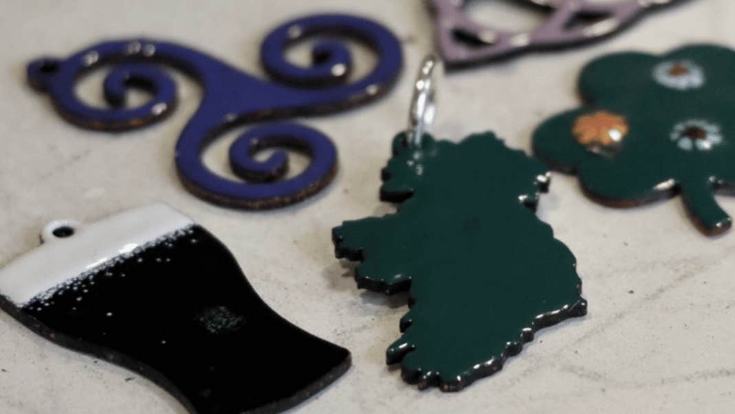 Introduction to Enamel Workshop, different enamel shapes ie a map of Ireland, a shamrock, a pint of Guinness.