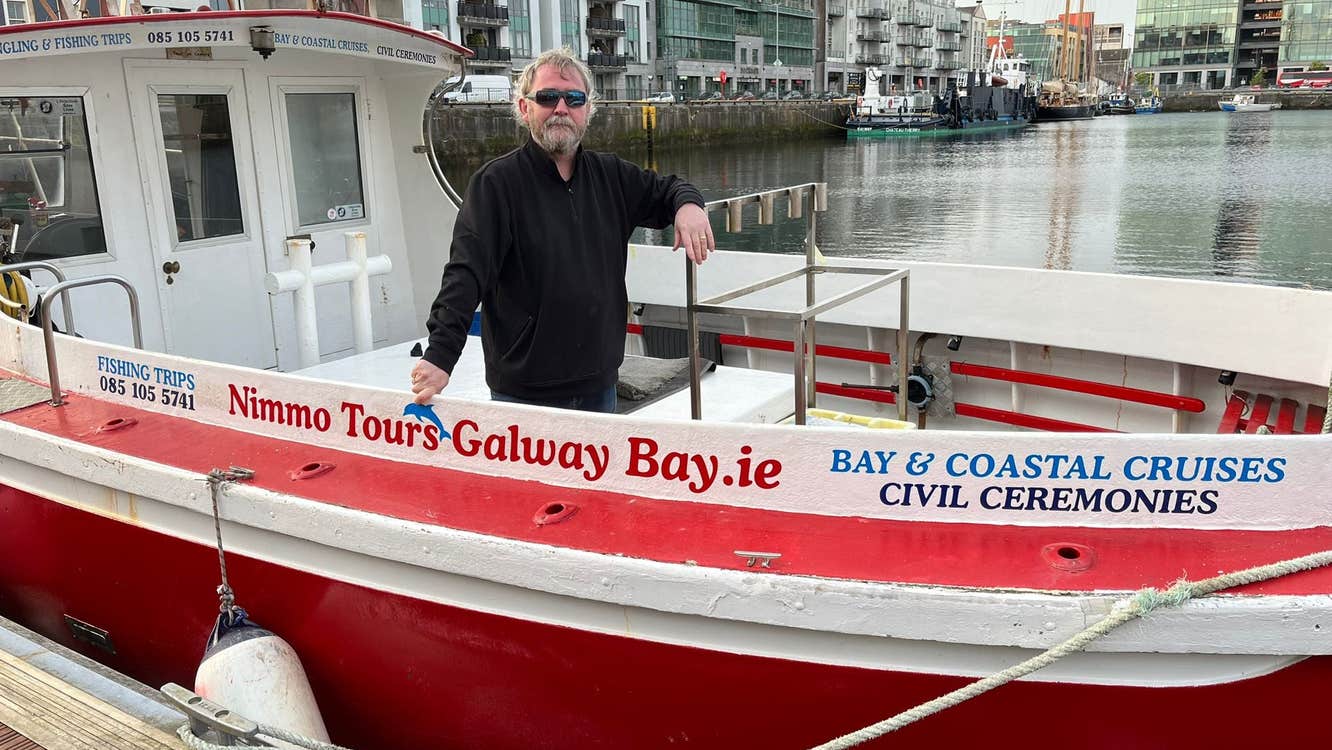 The skipper onboard the Nimmo Tours Galway Tours boat docked in Galway City