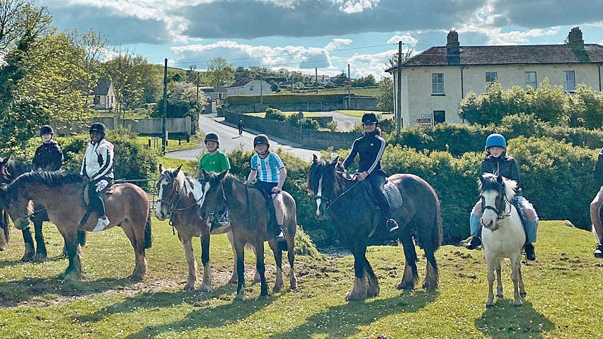 Boskill Equestrian Centre group of children outdoors on horses