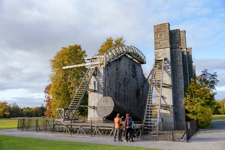 A group of people looking at "The Great Telescope" at the Historic Science Centre on the grounds of Birr Castle in County Offaly.