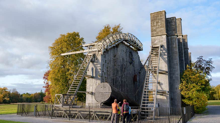 A group of people looking at "The Great Telescope" at the Historic Science Centre on the grounds of Birr Castle in County Offaly.