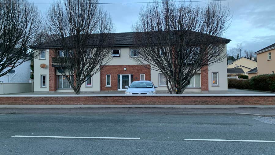 Exterior of apartment with private parking