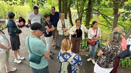 Tour Guide speaking to tour group in St Stephen's Green