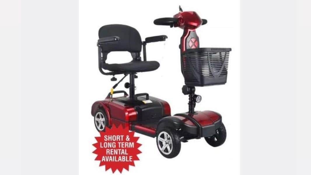 Red mobility scooter with black basket on the front