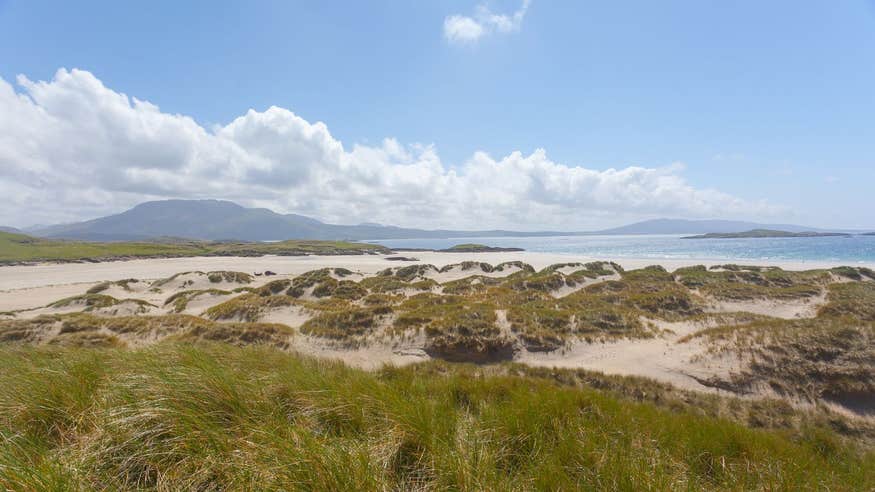 A sunny day at Silver Strand, Louisburgh, Mayo with mountains in the background.