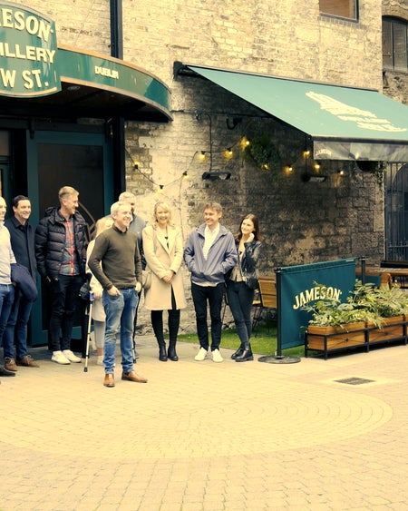 A group photo being taken by the Whiskey Island guide at Bow Street distillery