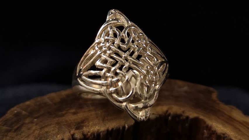 Silver design ring by Kinsale Silver on wooden display
