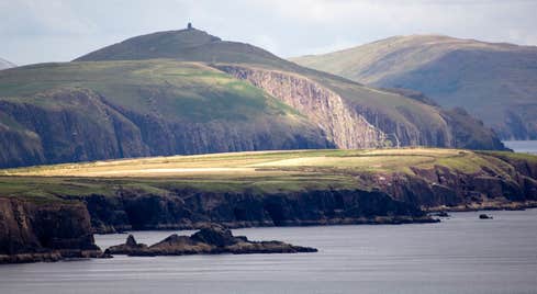 A calm sea surrounding the Dingle Peninsula in County Kerry