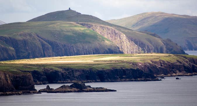 A calm sea surrounding the Dingle Peninsula in County Kerry