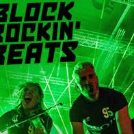 Poster with green lights and 2 people crouched down at camera.
