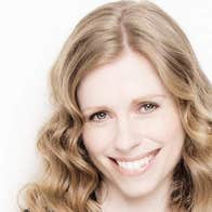 Fionnuala Moynihan is smiling in front of a white background.