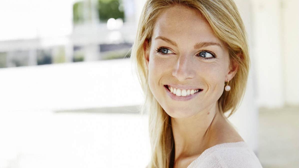 Festival of Voice: Laurence Servaes Song Recital, headshot of smiling woman against blurry white background.