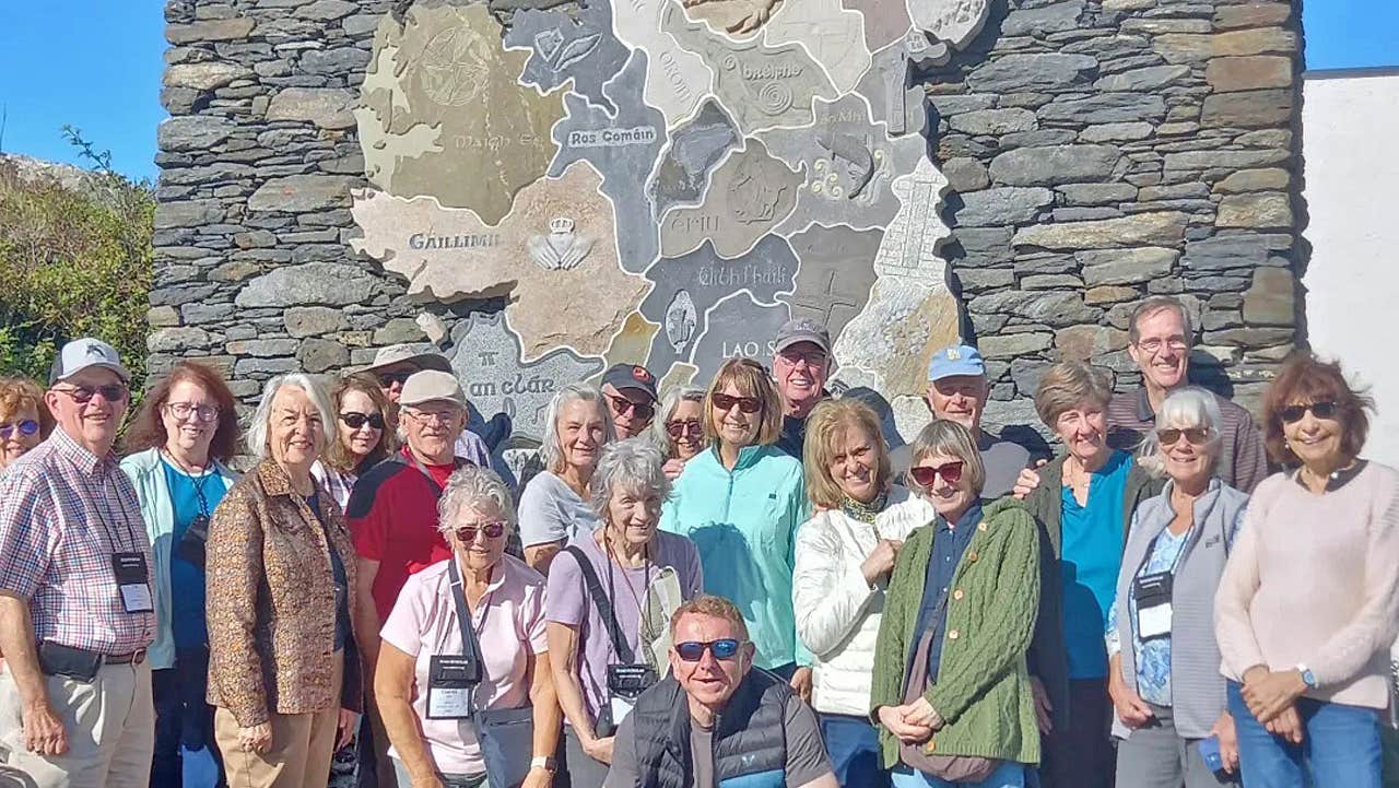 Galway Trails group in front of a stone map of Ireland in County Donegal