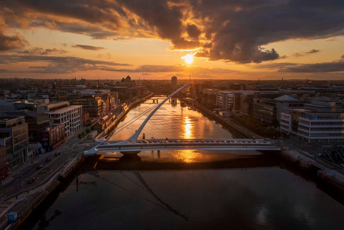 An aerial shot of the Samuel Beckett Bridge at sunset in Dublin.