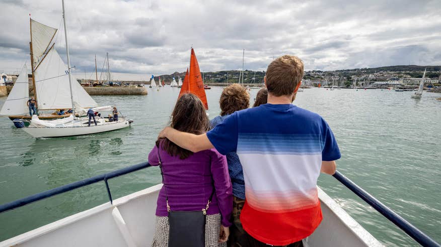 Family looking out on Dublin Bay from boat.