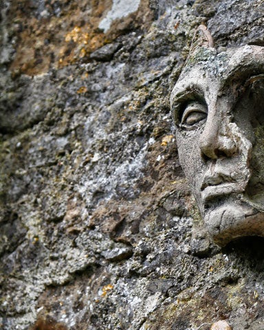 An ancient stone figure on a wall
